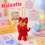 Malicette（マリセット）｜ハートを抱えた猫の編みぐるみキーホルダー 　▷ビビットオレンジの商品画像